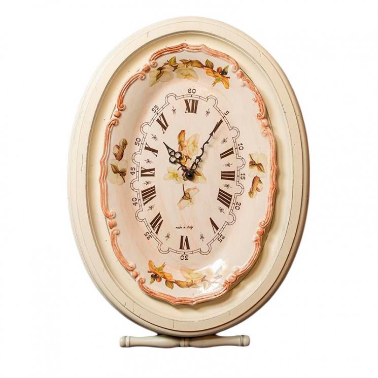 Овальные настенные часы с керамическим циферблатом в белом обрамлении Capanni - фото