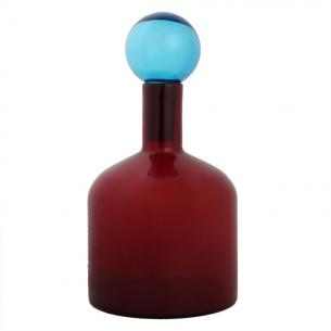 Красная ваза из толстого стекла в виде бутыли с крышкой