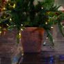 Искусственная ель в вазоне-подставке, украшенная LED-гирляндой Paradise  - фото