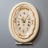 Овальные настенные часы с керамическим циферблатом в белом обрамлении Capanni  - фото
