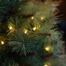 Штучна новорічна сосна LED-гірляндою, у фігурному вазоні Paradise  - фото