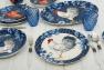 Набір яскравих обідніх тарілок із кераміки з синіми обідками, 4 шт. "Півень Індіго" Certified International  - фото